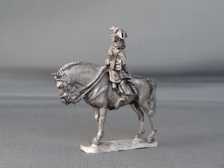 General officer on standing horse sword down