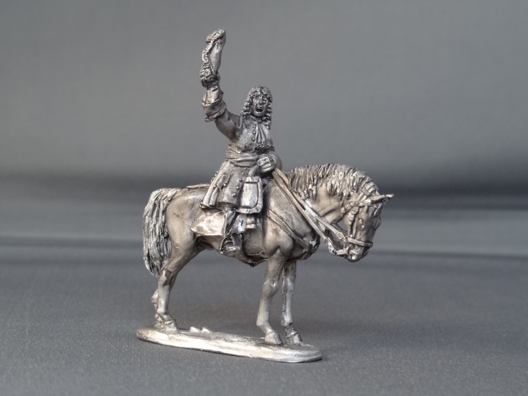 General officer waving hat on standing horse