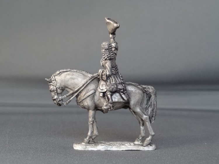 General officer waving hat on standing horse