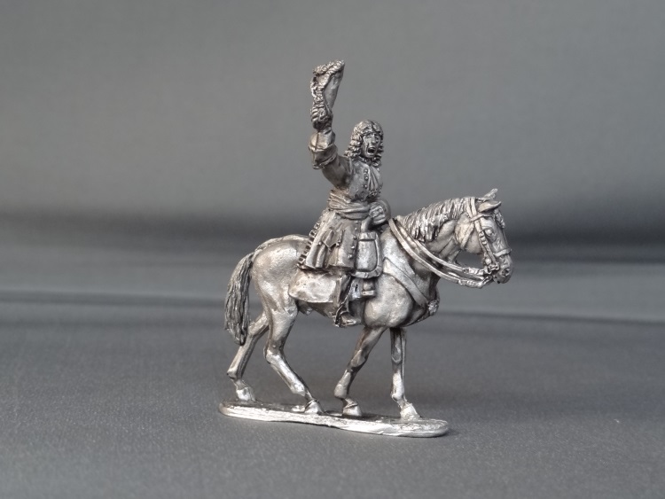 General officer waviing hat on walking horse