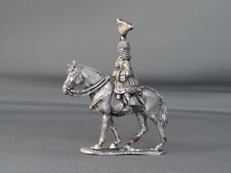 General officer waviing hat on walking horse
