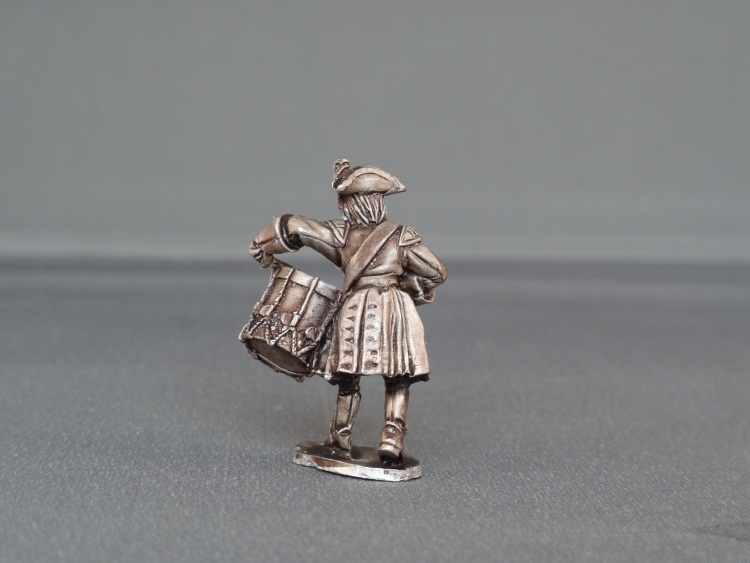 Drummer marching with cockade